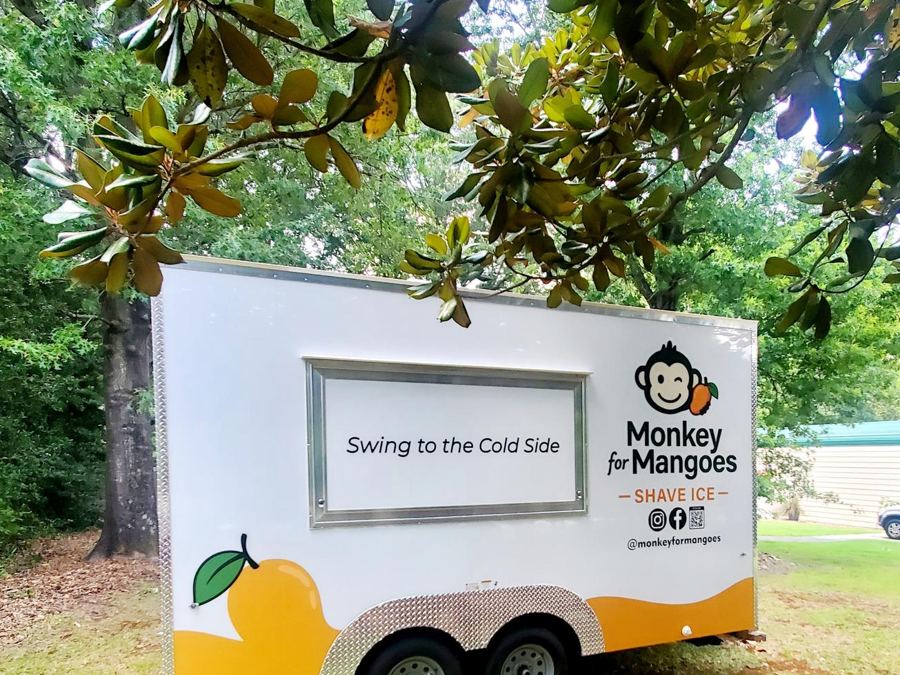 The Monkey for Mangoes trailer with its serving window open, reading “Swing to the Cold Side”